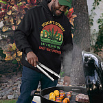 World's-Dopest-Dad-Vintage-Weed-Retro-Hoodie-Sweatshirt-pullover-hoodie-mockup-of-a-man-wearing-a-dad-hat-grilling-food