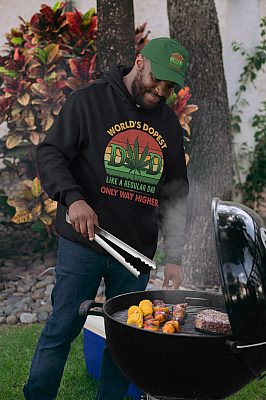 World's-Dopest-Dad-Vintage-Weed-Retro-Hoodie-Sweatshirt-pullover-hoodie-mockup-of-a-man-wearing-a-dad-hat-grilling-food