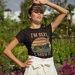 I'm Sexy And I Mow It Lawn Landscaping Meme T-Shirt - Funny Lawn Mower Tractor Cute Gardening Saying-t-shirt-mockup-of-a-woman-in-a-garden-blocking-the-sun-from-her-eyes