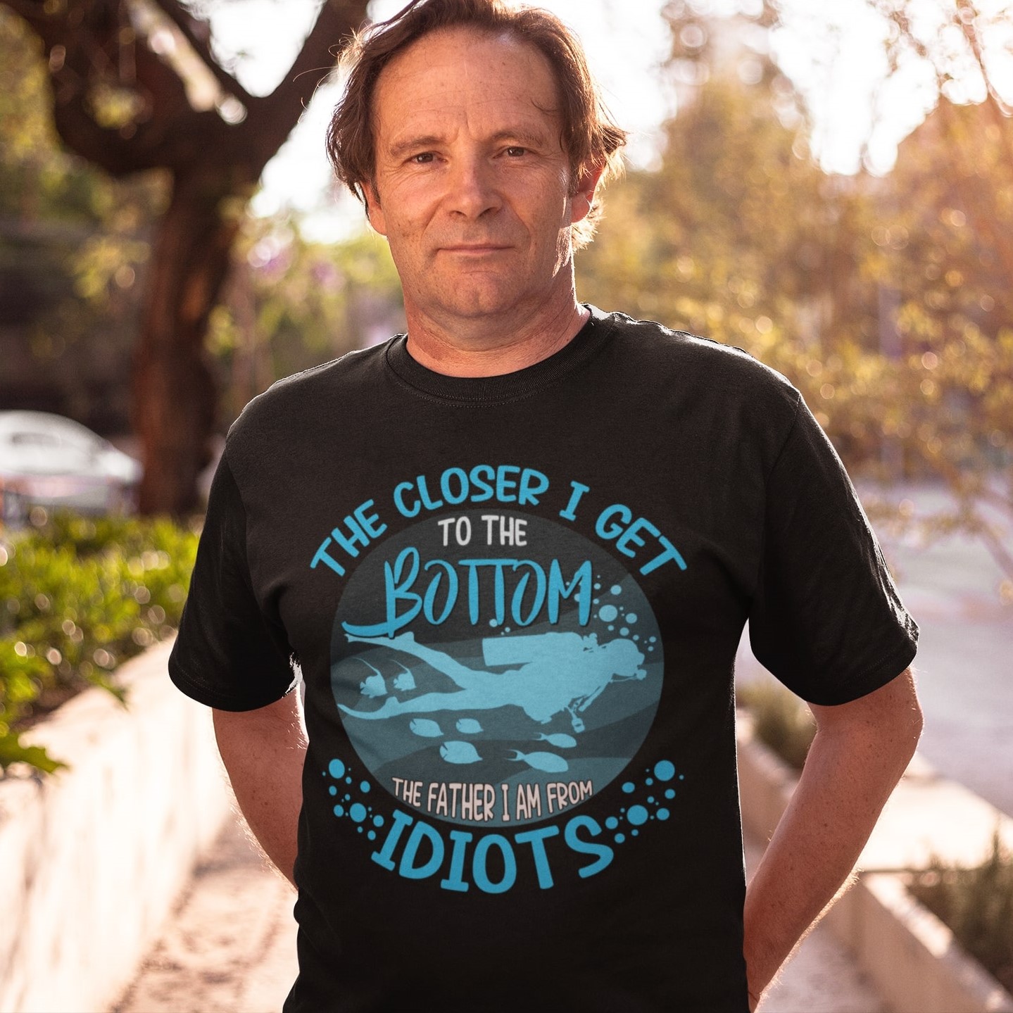 middle-aged-man-wearing-a-round-neck-tshirt-mockup-while-standing-against-the-sun-a15931